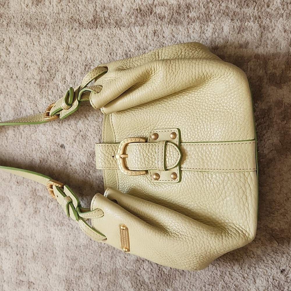 Dooney and bourke small light green leather saddle bag. Like new.